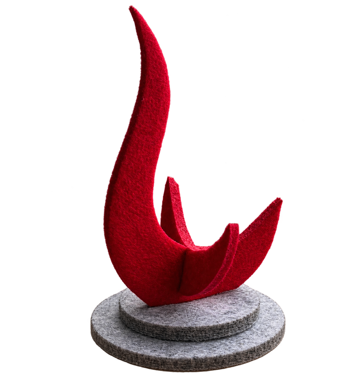 A red abstract sculpture on a stone base