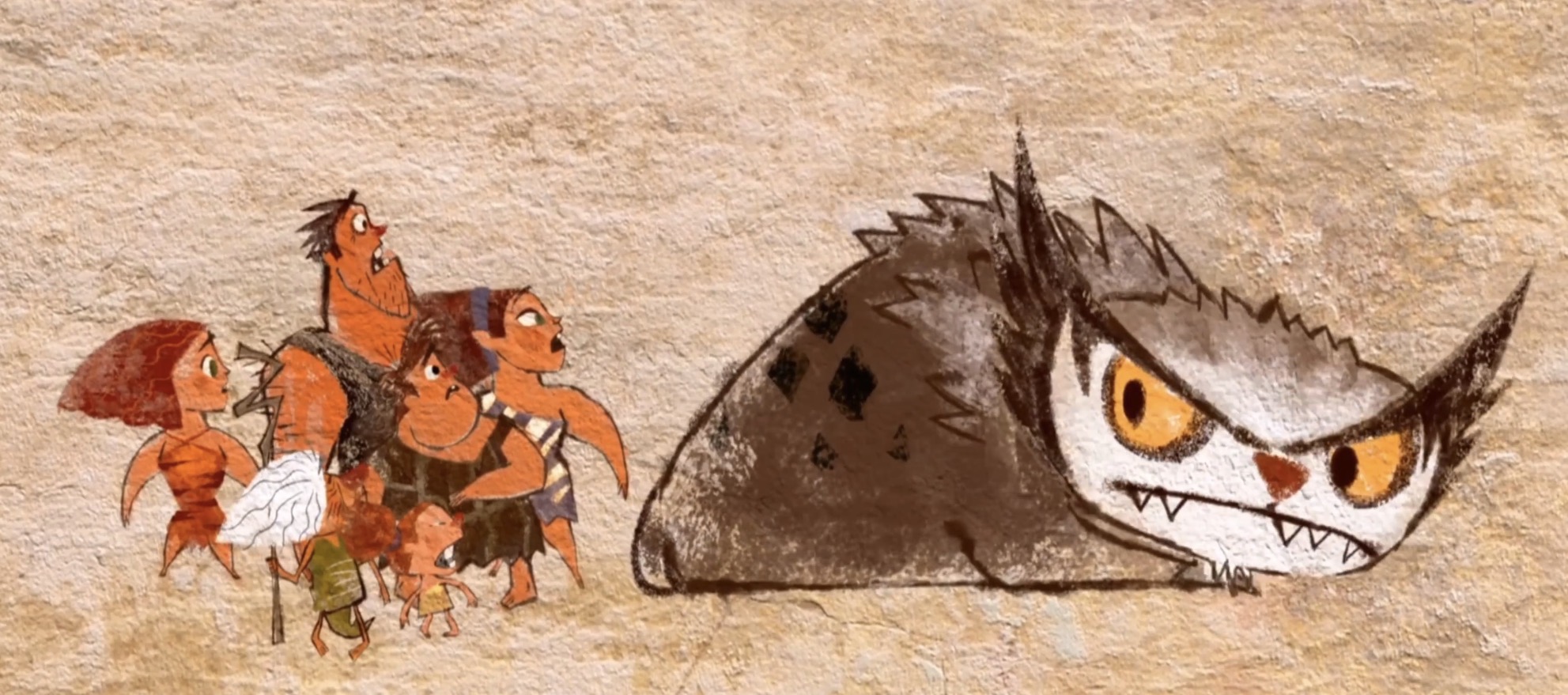 Stone Age people confronting a large beast